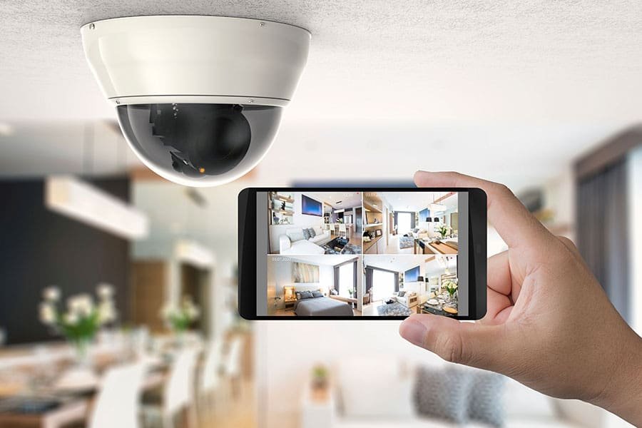 Hand-holding phone with surveillance footage