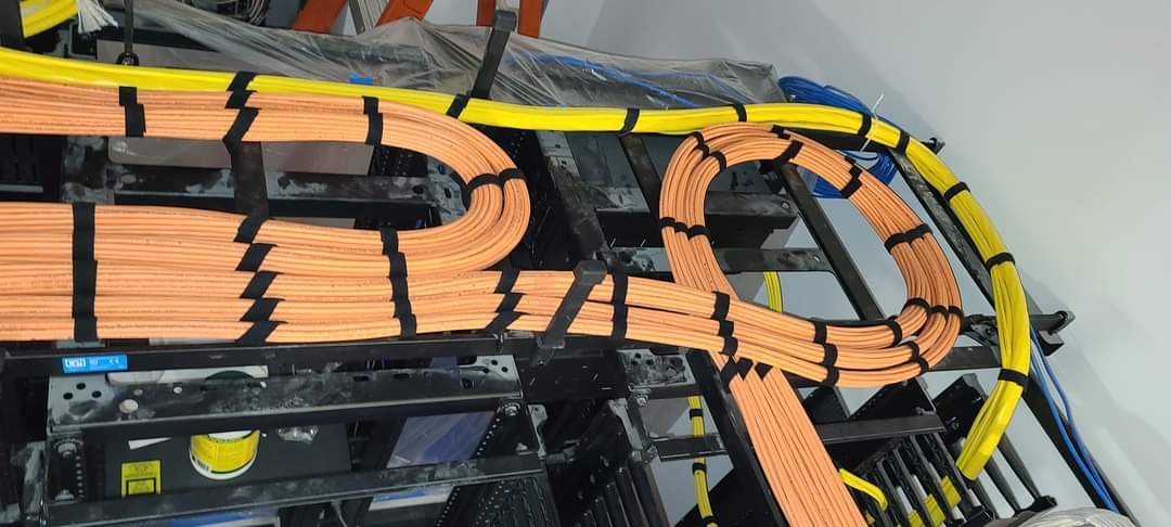 Organized orange cables in server room